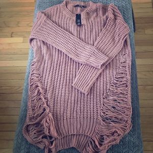 Distressed long sweater.